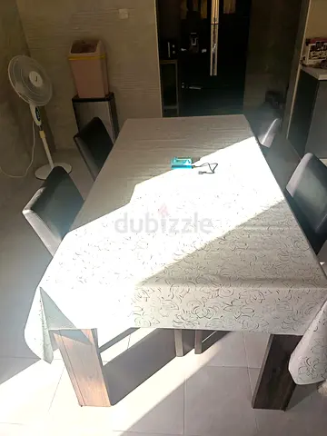 Wooden dining table with 4 chairs , good used condition