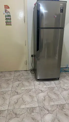 Steel finish top-freezer refrigerator - good condition