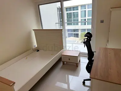 Double/Twin bed with bedside table.