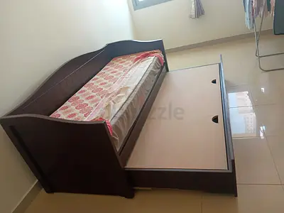 Sofa cum bed with storage space , brown color  never used.