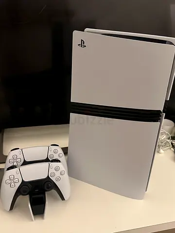 Ps5 pro with 2 controllers and charging station used only 5 months