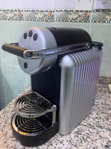 Used single-serve capsule coffee machine (Nespresso-style) - silver/black