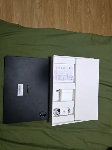Huawei tablet with charger and box - excellent condition, just taken out of the box 2-3 times.