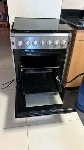 Used freestanding gas oven and stove in good working condition with gas cylinder