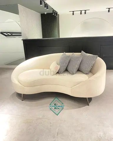 Curved Cream Two-Seater Sofa with Cushions