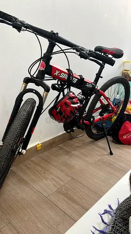 Red and Black Mountain Bike with Front Suspension - Good Condition