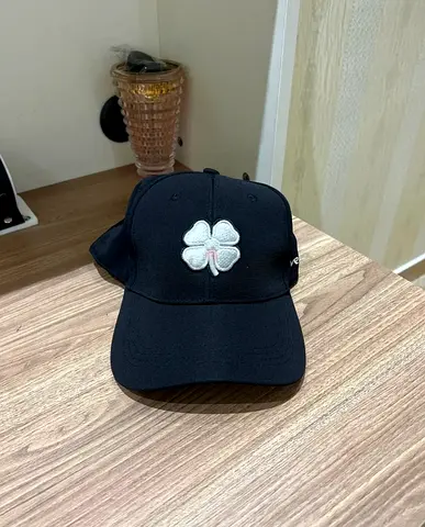 Black Baseball Cap with White Clover Patch - Good Condition
