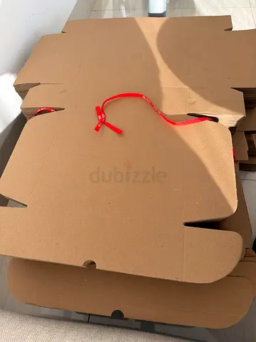 Unused flat cardboard boxes