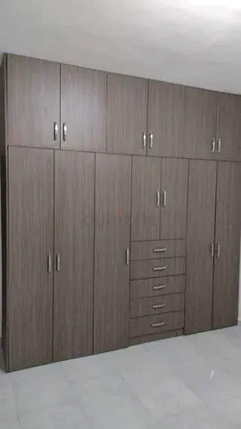 Large Built-in Wardrobe with Multiple Cabinets and Drawers - Grey Wood Finish