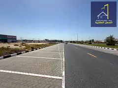 Land for sale in Industrial Area 18, directly on the main road.