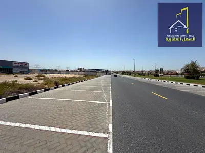 Land for sale in Industrial Area 18, directly on the main road.