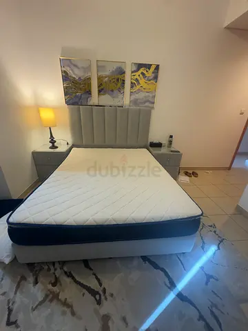 Queen bed frame with mattress and bedside tables - light grey