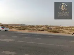 Land for sale in Al Sajaa area, prime location, area 127,000 square feet