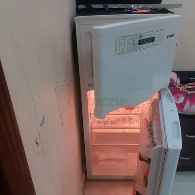 Compact mini fridge with freezer compartment - used