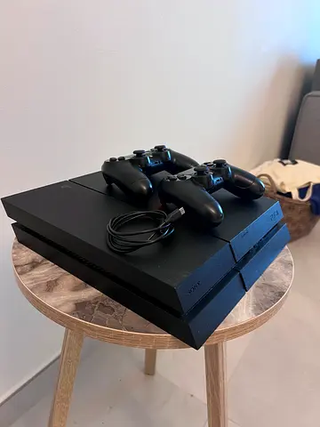 Sony PlayStation 4 with 2 Controllers and Cables (games included)