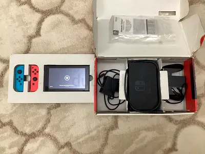 Nintendo Switch (Neon) with original box and accessories - Good working condition