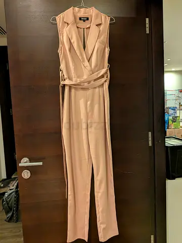 Elegant Light Pink Sleeveless Wrap Jumpsuit with Belt - Size Unknown