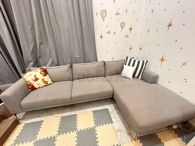 Light grey L-shaped corner sofa with chaise
