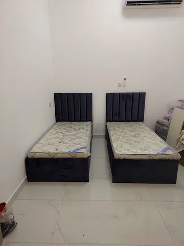 Pair of single beds with mattresses - grey colour