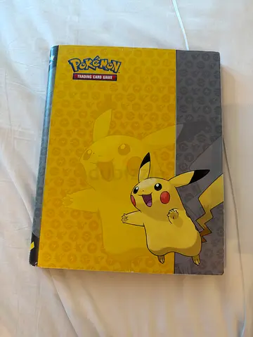 Pokémon book with some cards inside (there are more than the ones in the picture)