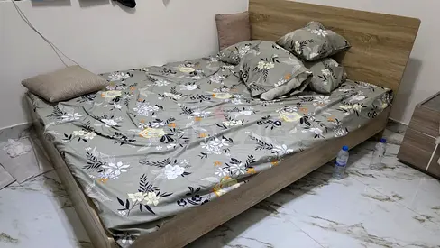 Good condition wooden double bed with mattress included