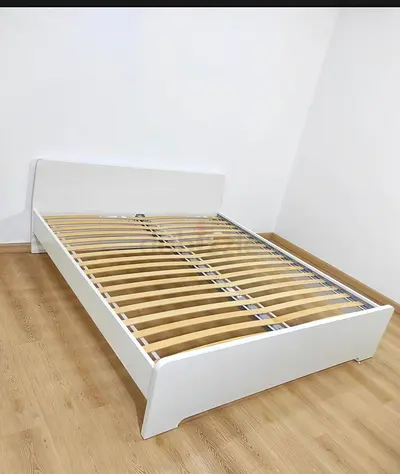White wooden double IKEA bed frame with mattress included