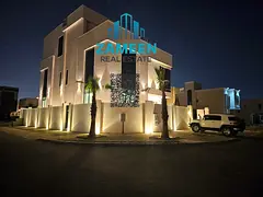 Luxurious Corner Villa with Elevator &amp; Roof Seating for Sale in Al Zahia