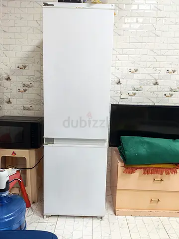 Tall white refrigerator-freezer, good working condition