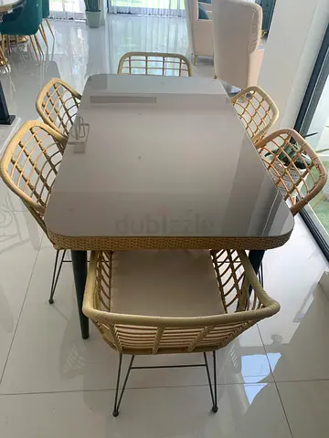 Rattan Dining Table with 4 Wicker Chairs – Good Condition