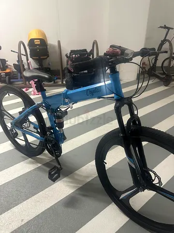 Blue full-suspension foldable bike, excellent condition