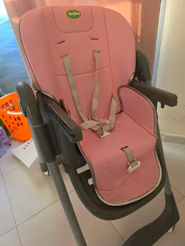 Pink adjustable baby high chair / booster seat in good condition