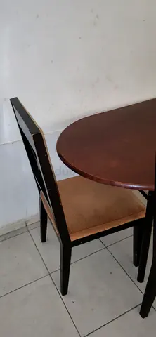 Solid wood dining table with four chairs - good condition