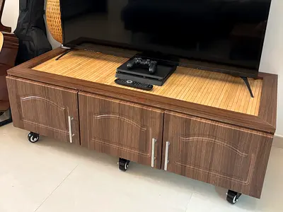 Low wooden TV cabinet with storage and caster wheels