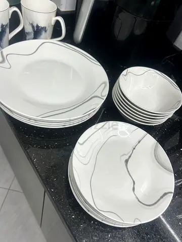 Dinner plates, side plates, bowls, cups and glasses.