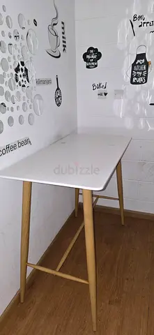 Small white dining table with wooden legs - good condition
