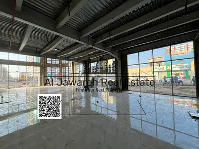For Rent: Commercial Shop in Al Hamidiya 1, located in a prime position directly on the main street within a large commercial complex