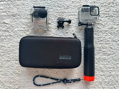 GoPro action camera kit with floating hand grip, mounts and cases. GoPro Not Included