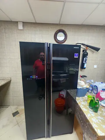 Large black side-by-side refrigerator, good condition