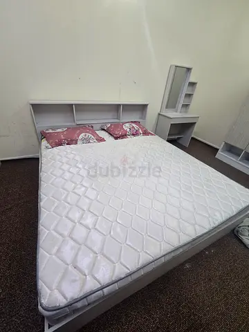 1 Queen bed frame with mattress and headboard shelving - used