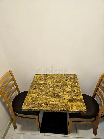 Small marble-top dining table with two chairs - compact set