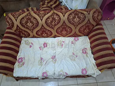 Two-seater patterned fabric sofa in good condition