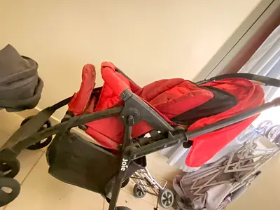 Red Joie lightweight foldable stroller in good condition