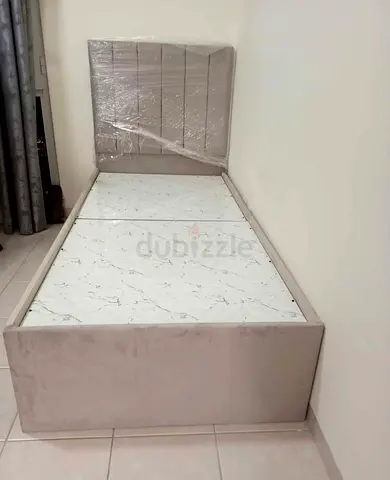 Single Sized Bed with Upholstered Headboard