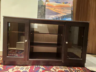 Dark wood TV stand / media cabinet with glass doors - good condition