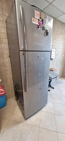 Stainless Steel Top-Freezer Refrigerator – Good Condition