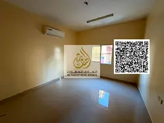For annual rent in Al Alia, Ajman: spacious studio apartment with a separate kitchen, located next t