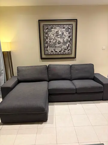 Three-seater grey L-shaped sofa with chaise lounge - good condition