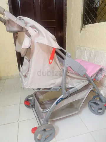 Lightweight beige baby stroller in good condition