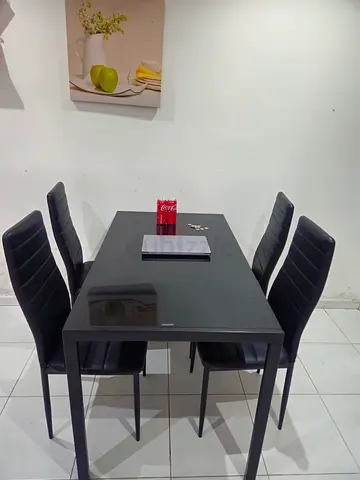 Modern black dining table with 4 matching chairs - good condition