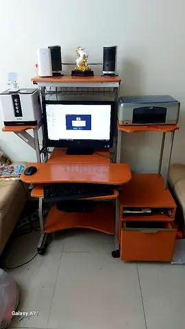 Compact orange wooden computer desk with shelves and storage - used